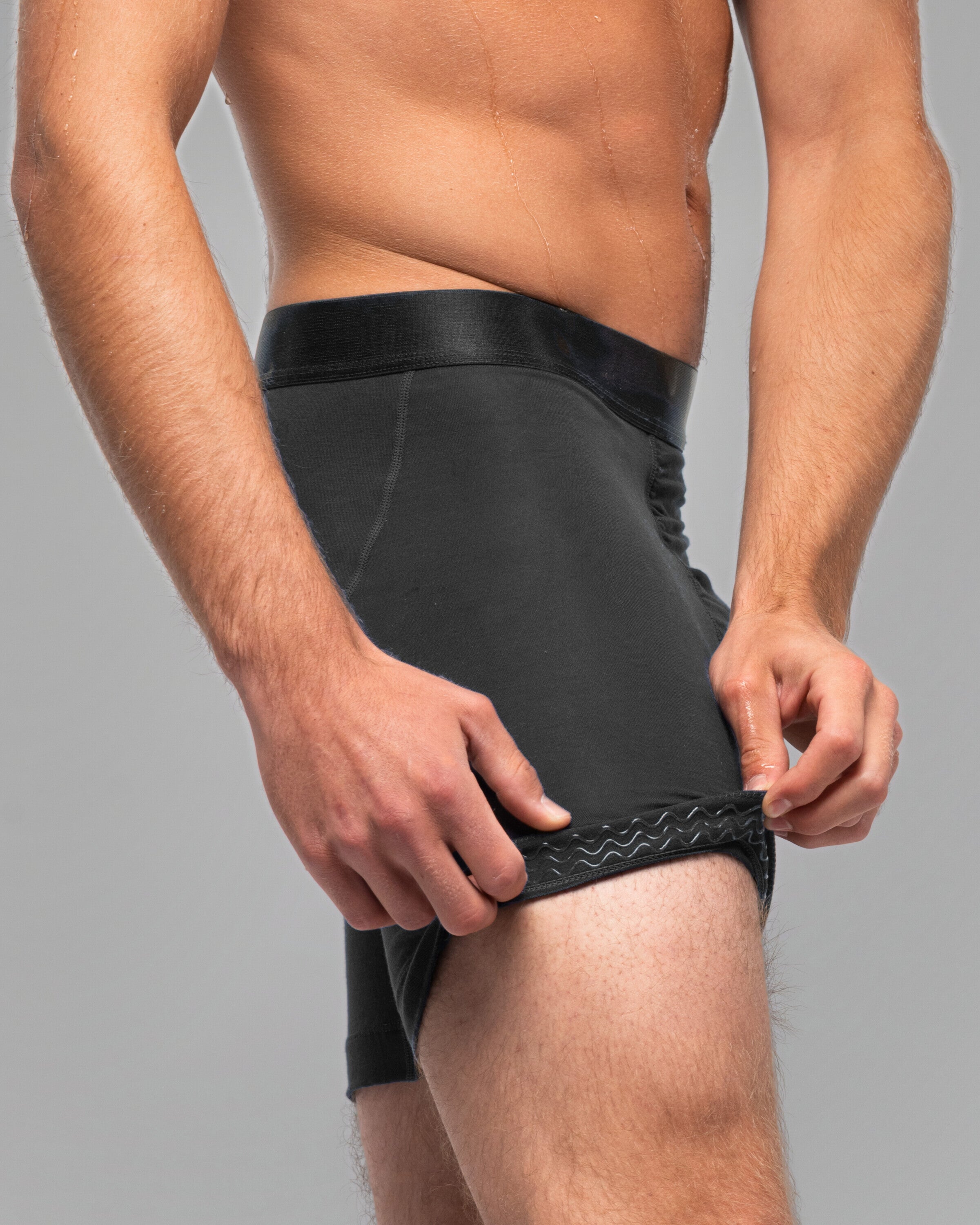 [Midnight 5] Nether Roam Boxer Brief in black, leg hem turned back to show the Trail Grip silicone band inside